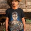 EREN YEAGE of a serious man with a t shirt posing by an old train wagon.jpg